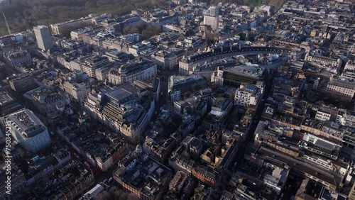 Dolly back pan up aerial shot over central London Soho and Belgravia photo