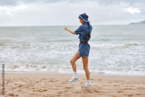 Active Summer Beauty: A Young Female Enjoying a Sunny Beach Lifestyle, Embracing Freedom by the Ocean