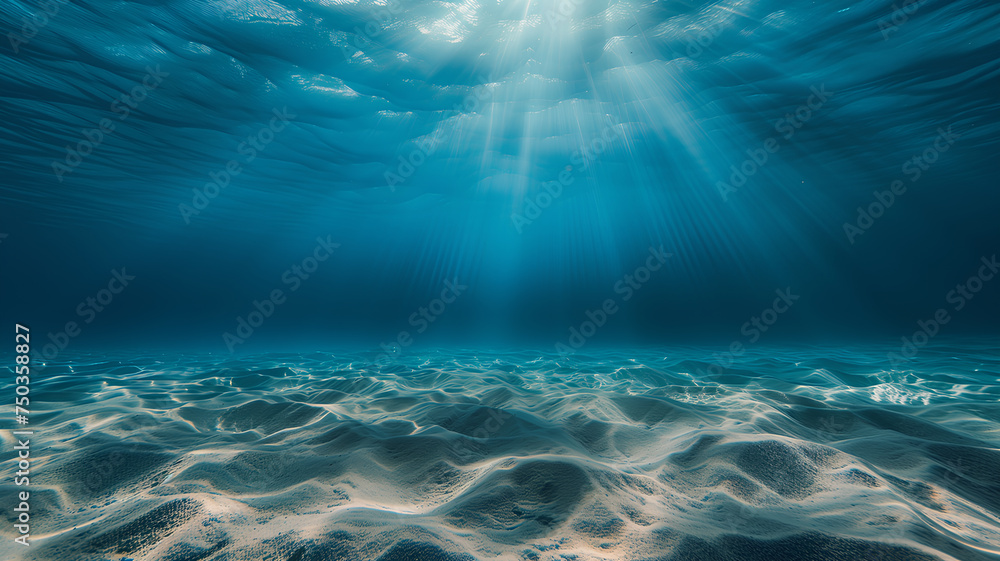 Underwater View with Sunlight Streaming Through Water
. Calm underwater landscape with the sun's rays piercing the clear blue water, creating patterns on the sandy seabed.
 - obrazy, fototapety, plakaty 