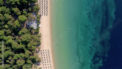 Aerial: Top down shot of tropical koukounaries beach at southern Skiathos island, Greece photo