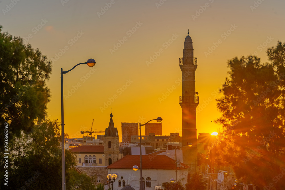 Sunrise in old Jaffa, clock tower and Mosque minaret