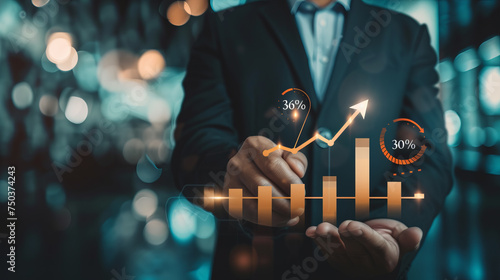 Interest rate and dividend, Businessman hold up arrow icon and percentage with graph indicators for investment growth. business financial investment, business growth, income, marketing and profit. photo