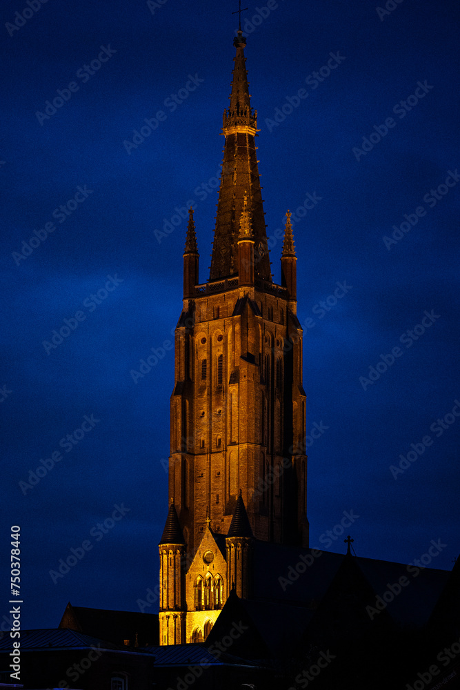 Bruges in Belgium. Church tower at night.