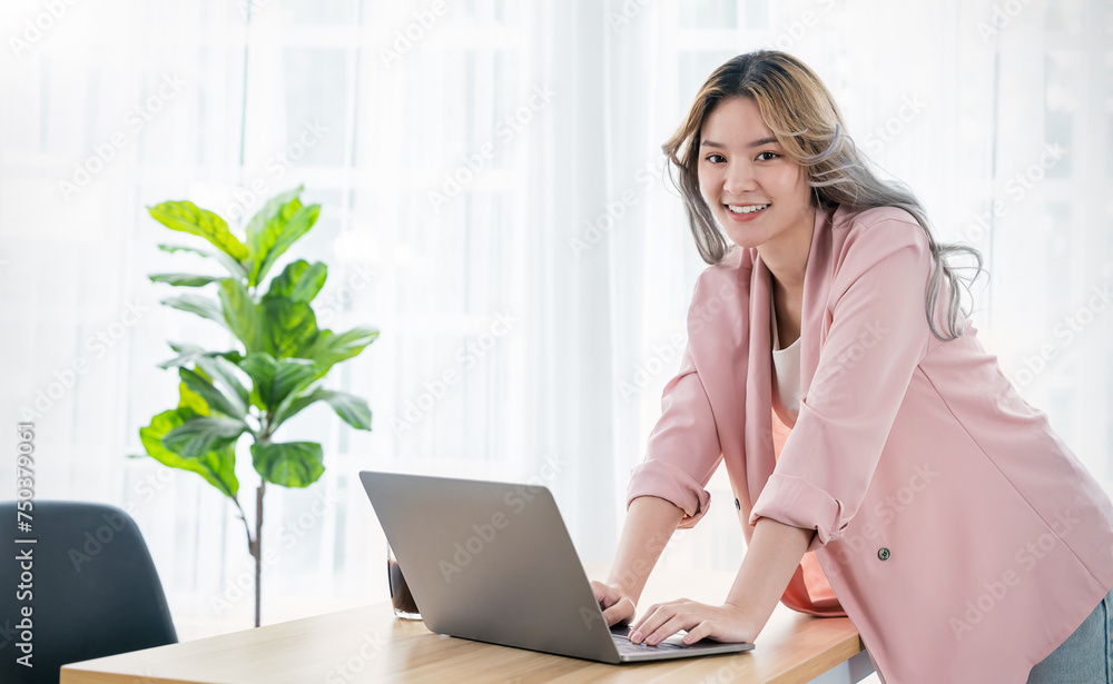Portrait smile beautiful business asian creative woman pink suit working office desk virtual computer. Small business people employee freelance online sme marketing start up e-commerce, woman on top Portrait smile beautiful business asian creative woman pink suit working office desk virtual computer. Small business people employee freelance online sme marketing start up e-commerce, woman on top