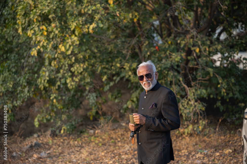 A senior businessman is having a coffee on his coffee break A senior businessman is having a coffee on his coffee break