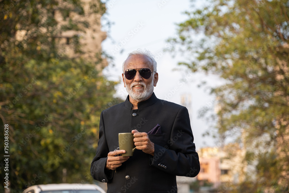 A senior businessman is having a coffee on his coffee break A senior businessman is having a coffee on his coffee break