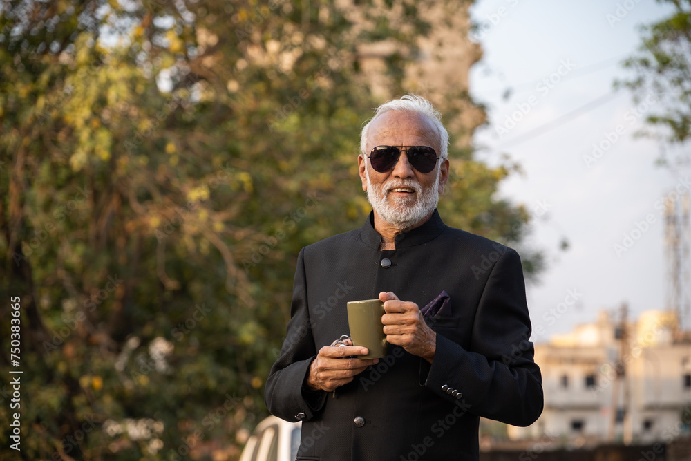 A senior businessman is having a coffee on his coffee break A senior businessman is having a coffee on his coffee break