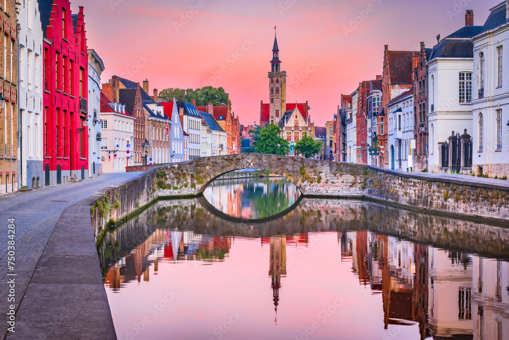 Bruges, Belgium, Flanders. Beuatiful Spiegelrei Canal, famous in Brugge city, sunrise colors.