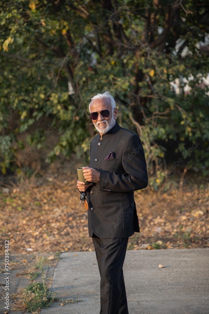 A senior businessman is having a coffee on his coffee break A senior businessman is having a coffee on his coffee break