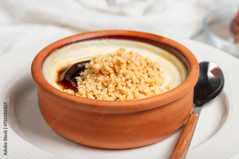 Rice pudding. Milky dessert. Oven-baked rice pudding dessert in a clay bowl. Close up Rice pudding. Milky dessert. Oven-baked rice pudding dessert in a clay bowl. Close up