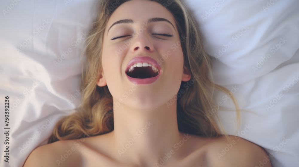 Woman's face during an orgasm in bed. Women's pleasure. A beautiful female with soft skin is enjoying and feels good. Woman's face during an orgasm in bed. Women's pleasure. A beautiful female with soft skin is enjoying and feels good.