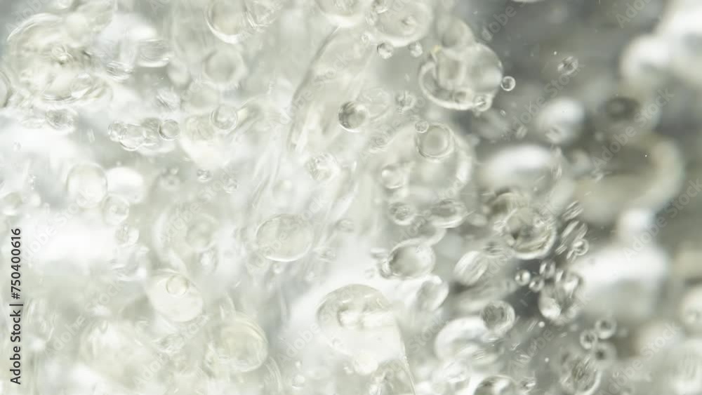 Thousands of oil droplets in water, air bubbles on a black background. Macro shot. Thousands of oil droplets in water, air bubbles on a black background. Macro shot.