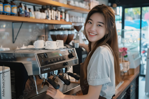 A woman is smiling and standing behind a coffee machine