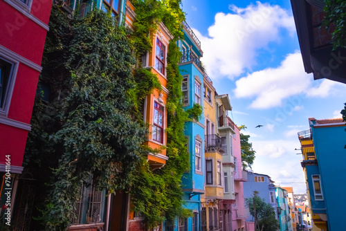 Colorful houses on the Balat are popular among tourists on a sunny day. Balat is a quarter in Istanbul's Fatih district. Istanbul, Turkey photo