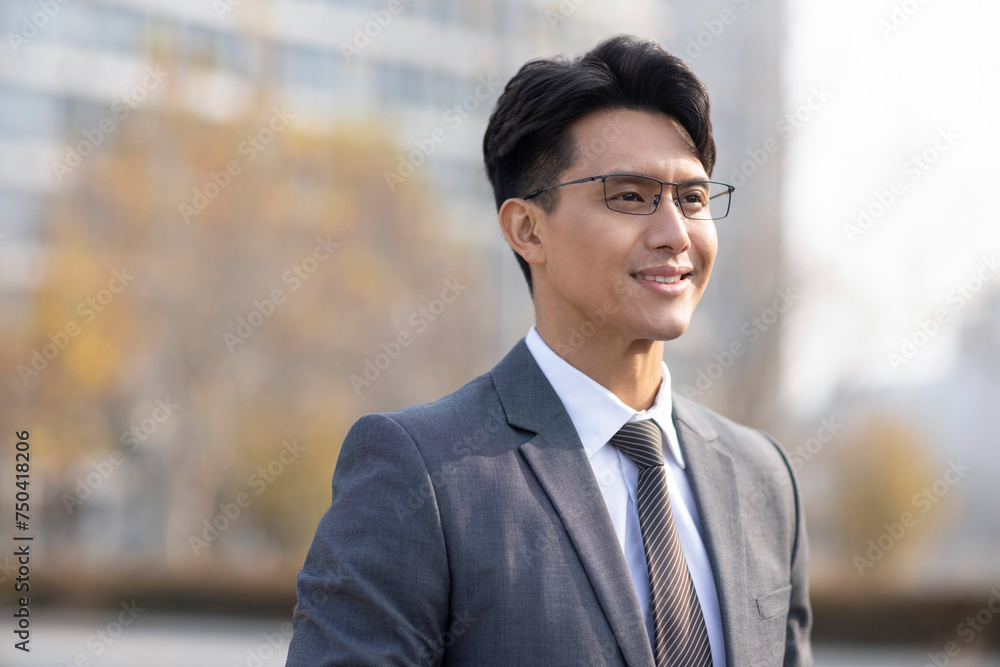 Confident businessman looking at view Confident businessman looking at view