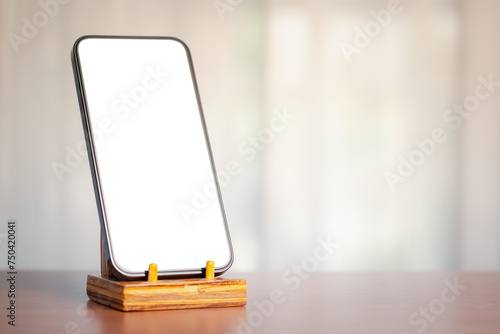 Smartphone on stand, white screen, soft light, technology and communication blend