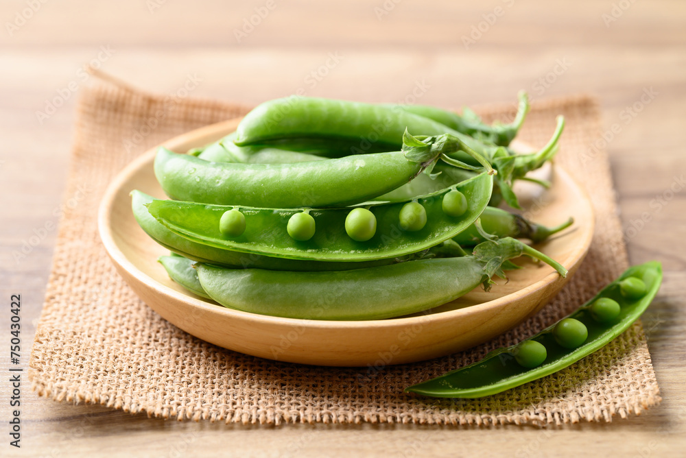 Fresh green pea in wooden bowl, Food ingredient Fresh green pea in wooden bowl, Food ingredient