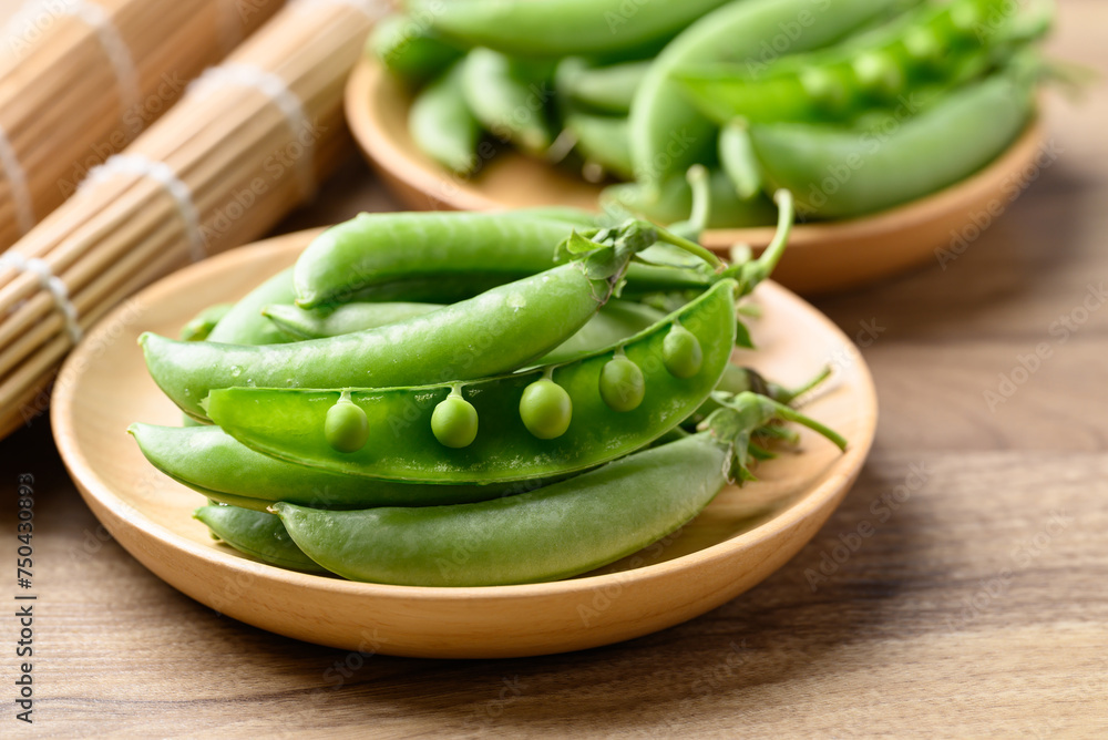Fresh green pea in wooden bowl, Food ingredient Fresh green pea in wooden bowl, Food ingredient