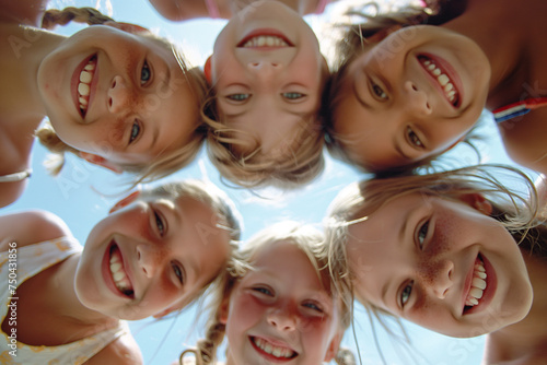 Circle of Joy: Group of Happy Children Lying Down with Heads Together
