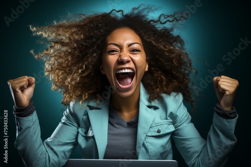 Happy afro american woman with laptop - embodying the concepts of success and victory