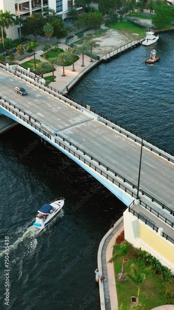 Aerial view. Drone flight over Miami river with bridges. Traffic of cars and boats on the river. City center. Vertical video. Aerial view. Drone flight over Miami river with bridges. Traffic of cars and boats on the river. City center. Vertical video.