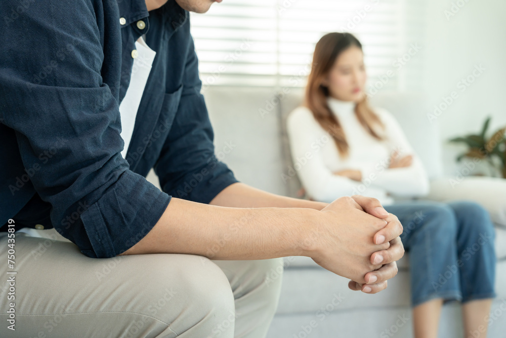 Fototapeta premium Divorce. Asian couples are desperate and disappointed after marriage. Husband and wife are sad, upset and frustrated after quarrels. distrust, love problems, betrayals. family problem, teenage love