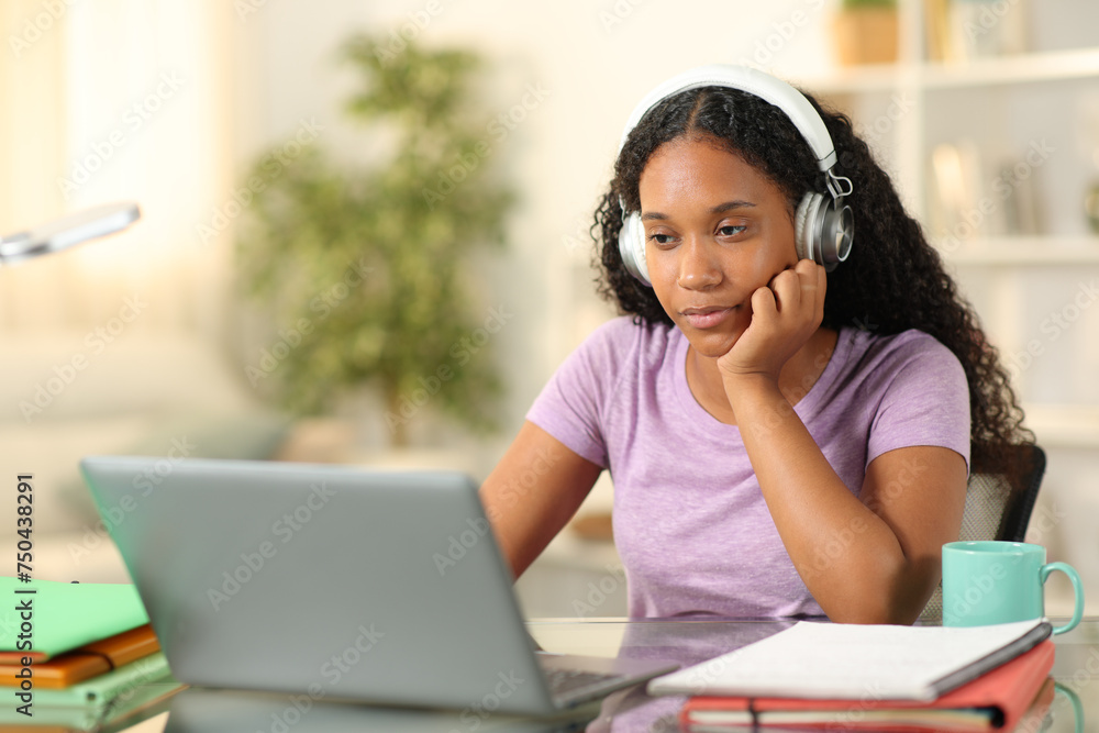 Black student e-learning online at home Black student e-learning online at home