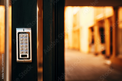 Keypad door lock at residential building entrance photo