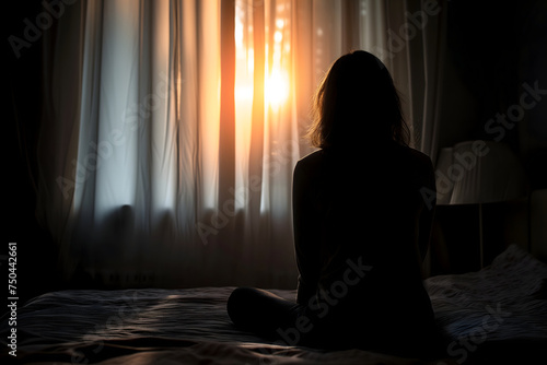 Silhouette woman sitting on the bed in the dark room with lamp, Sad woman. Neural network generated image. Not based on any actual scene or pattern. © lucky pics