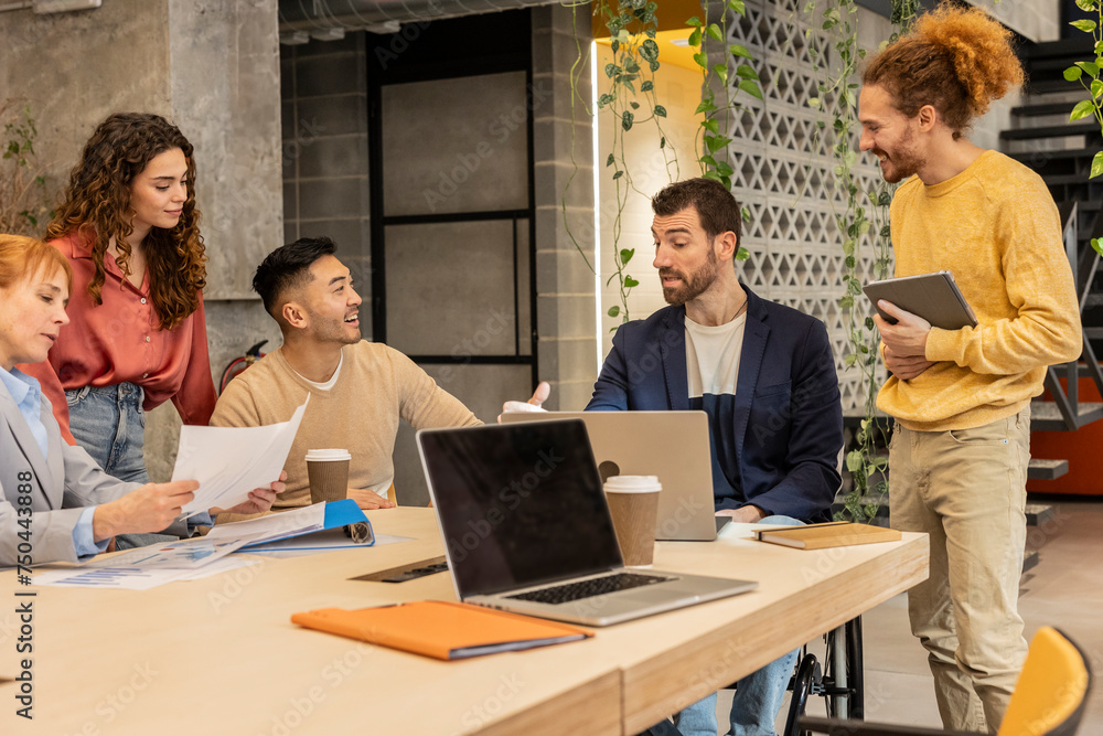 Businessman explaining colleagues in meeting at office Businessman explaining colleagues in meeting at office