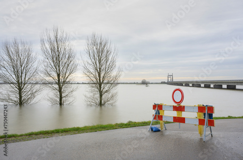 Netherlands, Gelderland, Zaltbommel, View of river Waal flooding surrounding land after prolonged rainfall photo