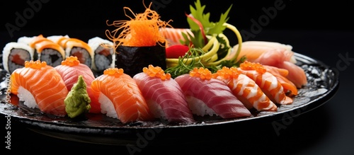 A Plate of Su Sui with Various Types of Sui - Delicious Seafood Sushi and Rolls on Black Dish