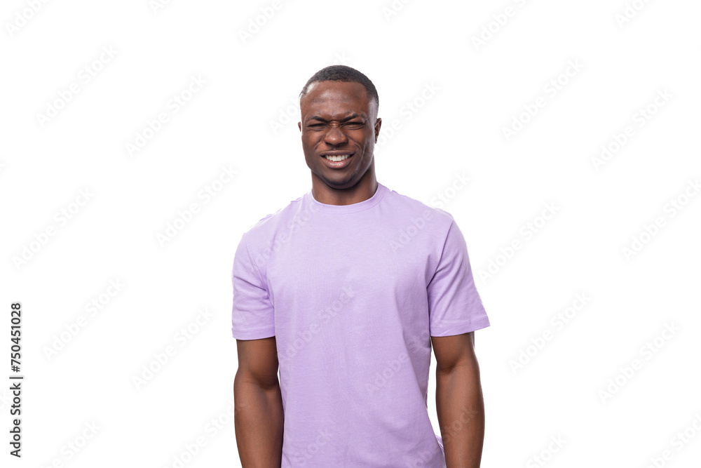 young handsome american man looks at the camera in surprise on a white background young handsome american man looks at the camera in surprise on a white background