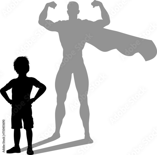 A superhero child or kid boy revealed by his shadow silhouette as a super hero in a cape. © Christos Georghiou