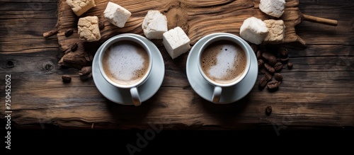 Rustic Charm: Two Cups of Coffee on a Wooden Table with Cozy Napkins and Sweet Sugar Cones © HN Works