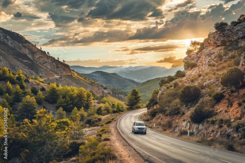SUV car in spain mountain landscape road at sunset photo