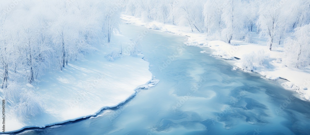 Aerial View of a Serene River Flowing Through a Snow-Covered Landscape