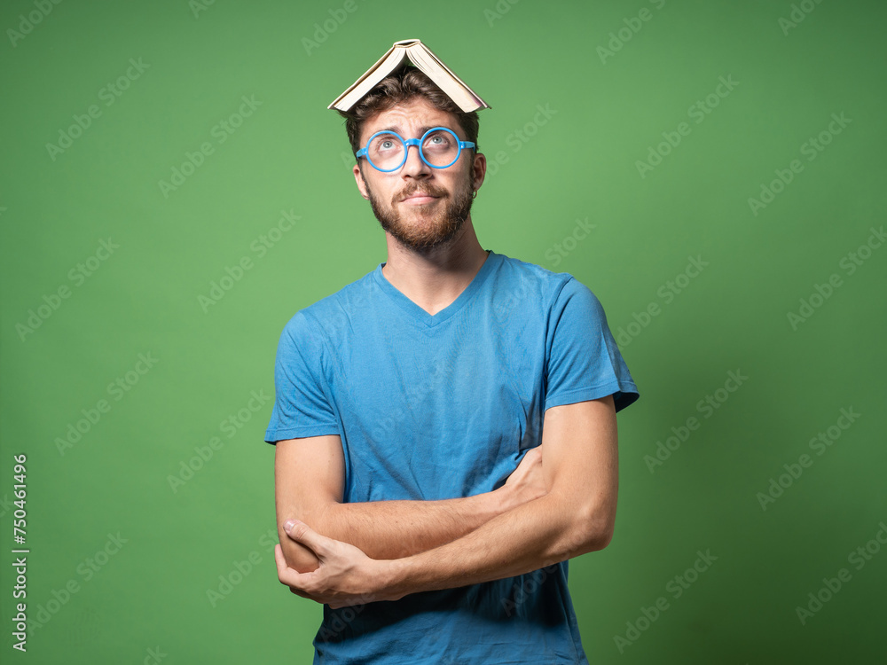Nerdy Man with Book on Head and Blue Glasses Nerdy Man with Book on Head and Blue Glasses