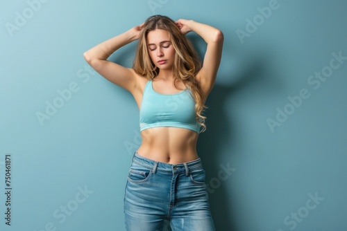 A beautiful young woman in a blue sports bra top. Suitable for fitness and lifestyle concepts