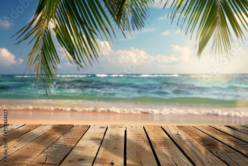 Top of wood table with seascape and palm leaves, blur bokeh light of calm sea and sky at tropical beach background. Empty ready for your product display montage.  © Straxer
