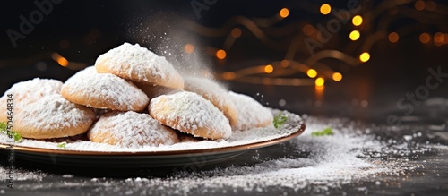 A Festive Display of Powdered Sugar Cookies, a Delightful Treat for Celebrating Eid and Special Occasions photo