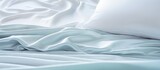 Serenity in White: Close-Up of Soft Bedding Sheets with Text Space for Minimalist Home Decor