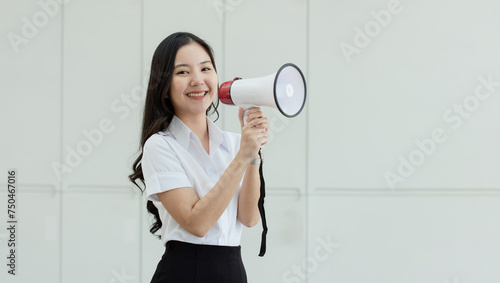 Woman holding a racket, Young asian woman holding a megaphone over isolated white background.