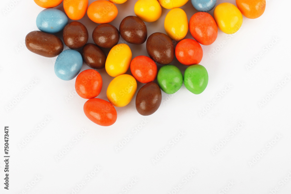 Peanut candy covered with colorful chocolate isolated on white background Peanut candy covered with colorful chocolate isolated on white background