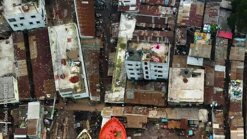 Elevating Aerial Shot of Rooftops from a Slum or Unfavored Neighbourhood in Bangladesh photo