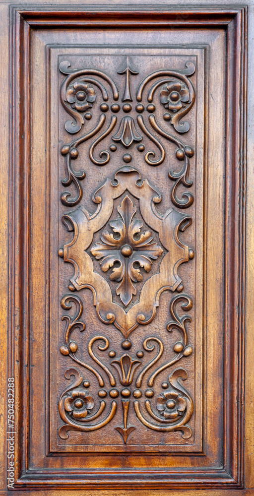 Carved wooden panel on a door