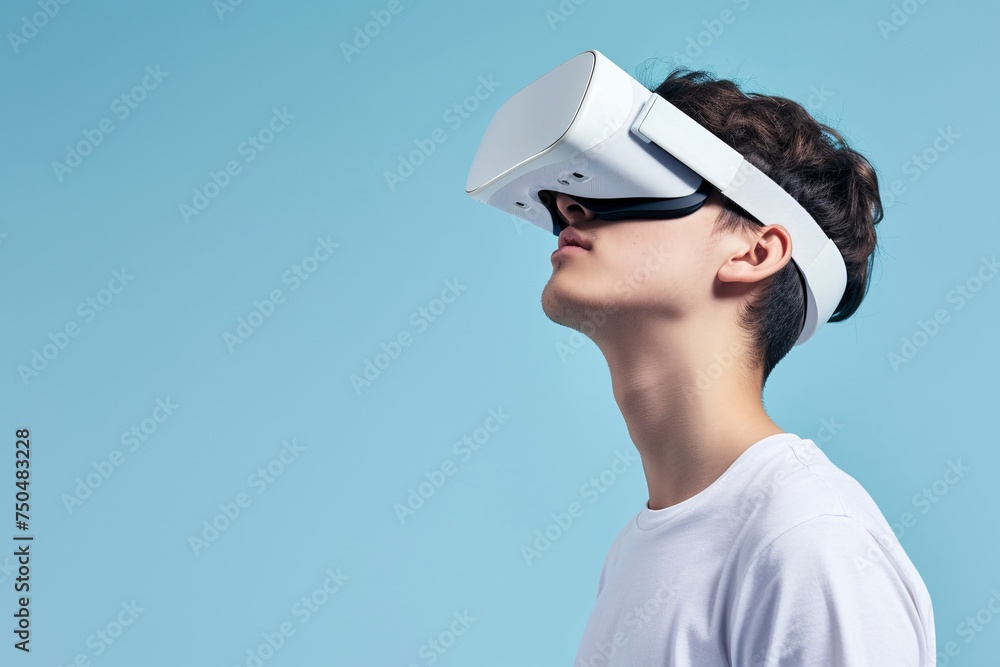 Young Man Engaged in Virtual Reality Experience Against Blue Background. Generative AI Young Man Engaged in Virtual Reality Experience Against Blue Background. Generative AI