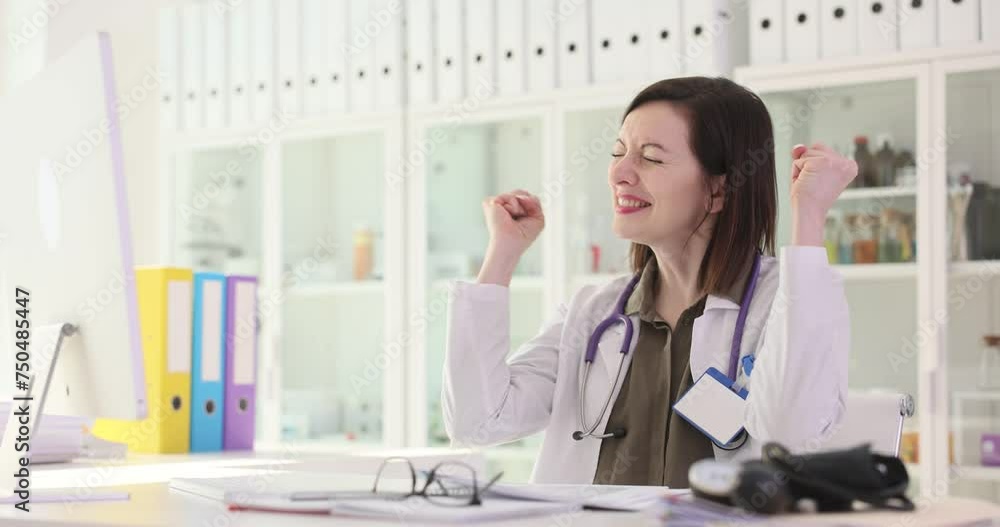 Woman doctor rejoicing at good patient test results in paper documents 4k movie slow motion. Positive mood of doctors concept Woman doctor rejoicing at good patient test results in paper documents 4k movie slow motion. Positive mood of doctors concept