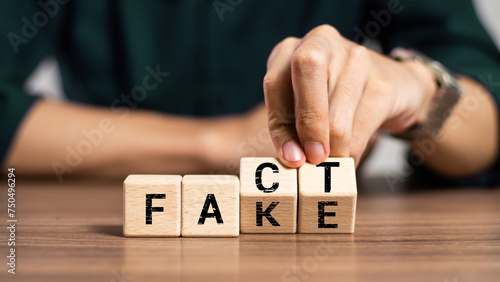 Foto Fact or Fake concept, Hand flip wood cube change the word, April fools day