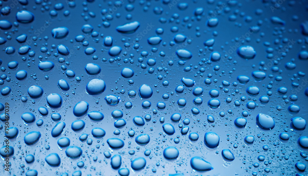 Close-up blue water drops, detail of blue surface water-repellent on glass for background. raindrop waterdrops with selective focus Close-up blue water drops, detail of blue surface water-repellent on glass for background. raindrop waterdrops with selective focus